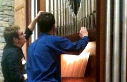 Student tuning pipe at organ tuning
                        workshop at UE.