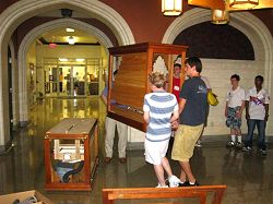 Students carrying small Rathke organ inside.